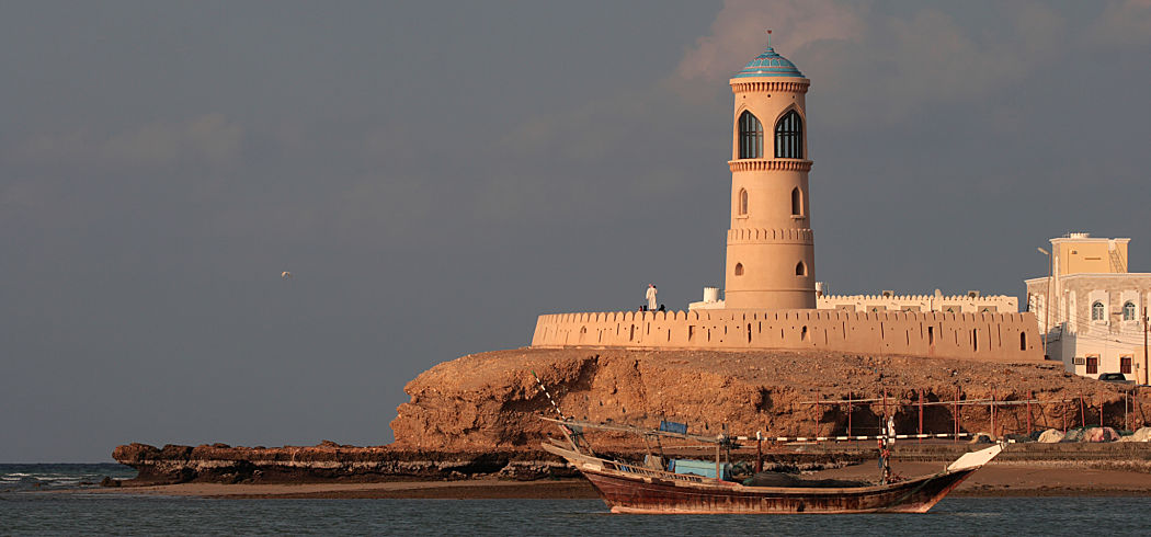 Oman lighthouse dhow dreamstime l 16399261 opt